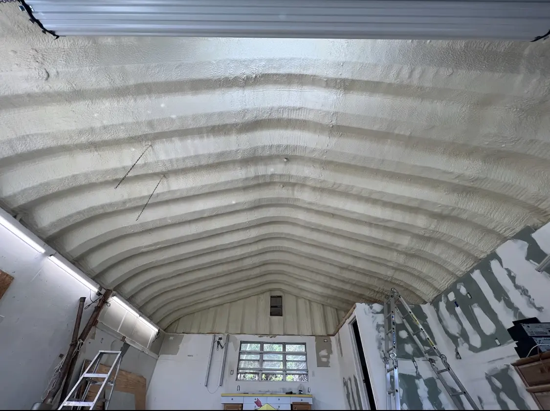 Spray polyurethane foam applied to the underside of a metal roof deck in Winterville